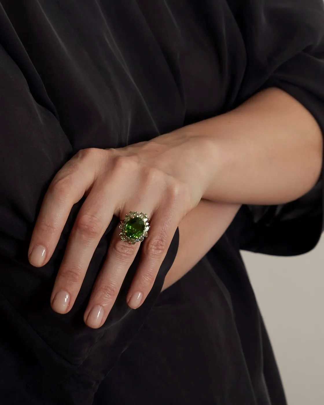 Ring with moldavite and green sapphires